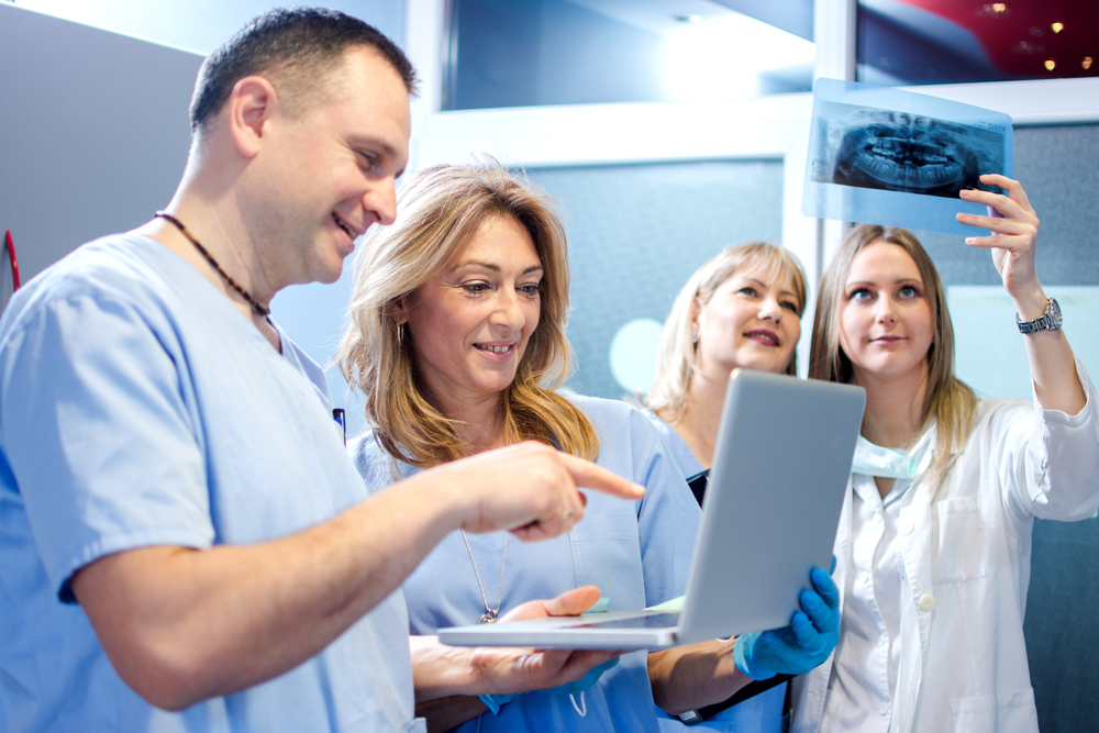 Group,Of,Cheerful,Healthcare,Workers,Working,Together,At,Doctor's,Office.